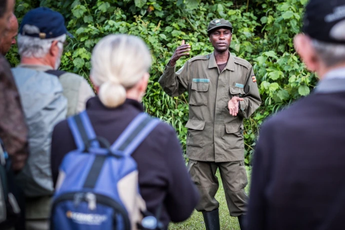 a guide briefing tourists for gorilla tracking