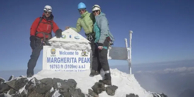 Rwenzori Mountains National Park tourists at the peak of Mt. Rwenzori