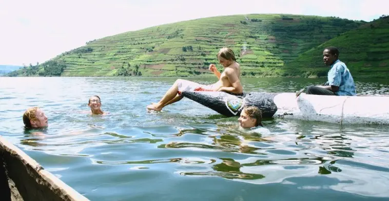tourists swimming in Lake Bunyonyi